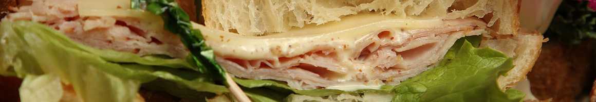 Eating Deli Sandwich at Rossi's Deli restaurant in San Francisco, CA.